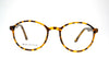 Tiger brown round frame in sheet material.