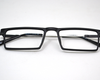 Non-breakable, rectangular frame in TR material for unisex. The metal sides are flexibles and non breakable.(Black)