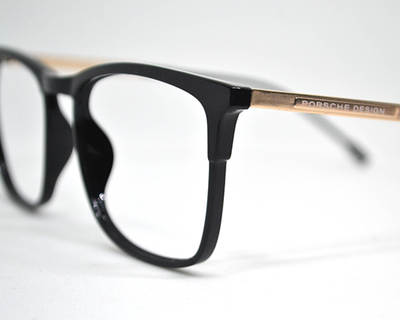 Non-breakable, retroround black & gold frame in TR material for unisex.