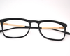 Non-breakable, retroround black & gold frame in TR material for unisex.