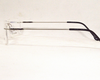 Silver color light weight Rimless frame for unisex, with spring.